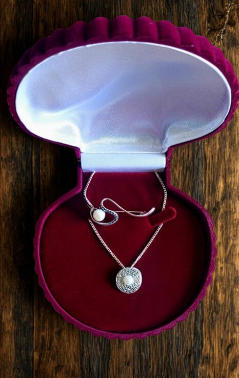 Silver jewelry gift set with pearl brooch and pendant in elegant velvet box